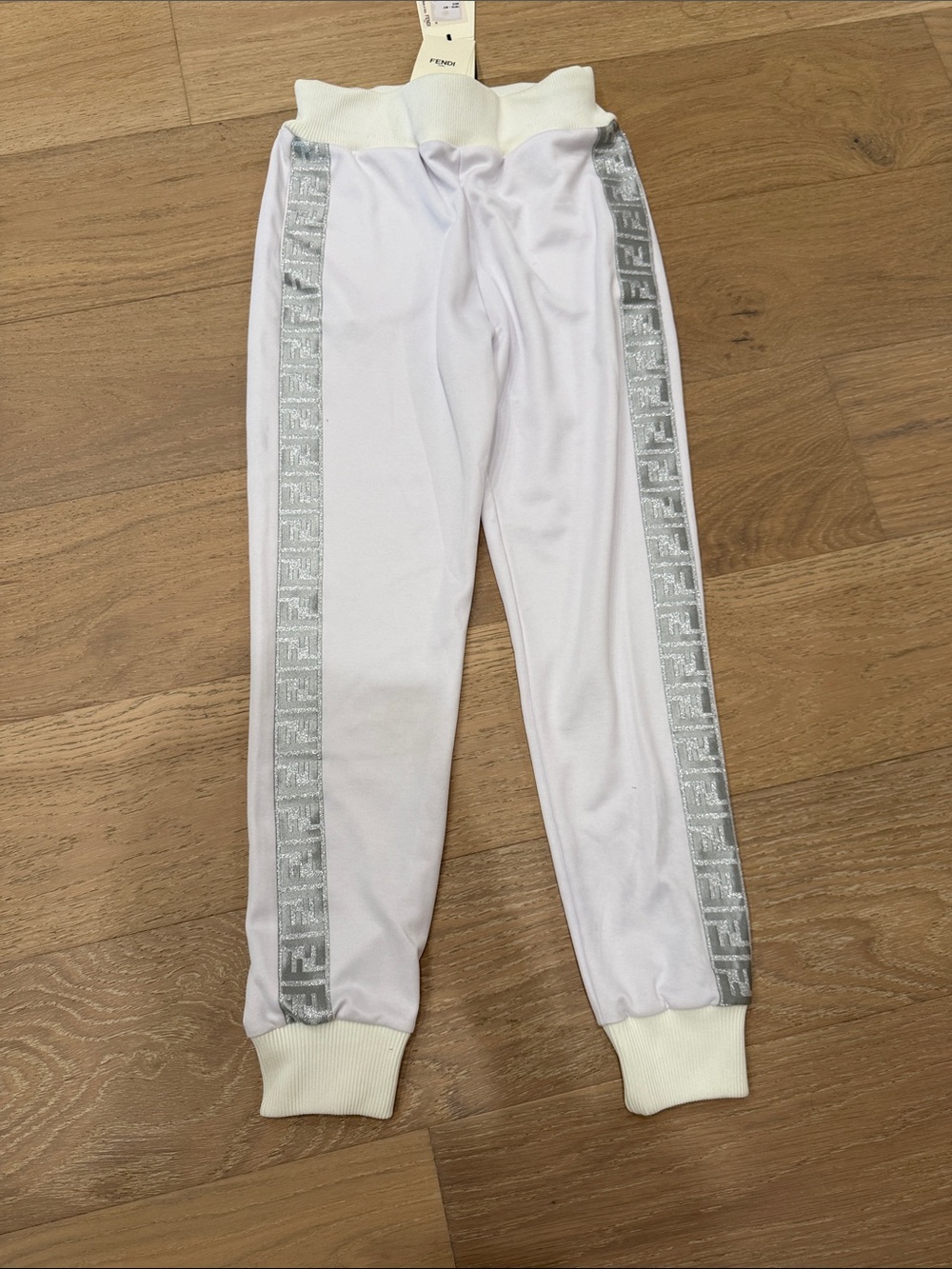Brand new authentic white pants with FF logo silver trim